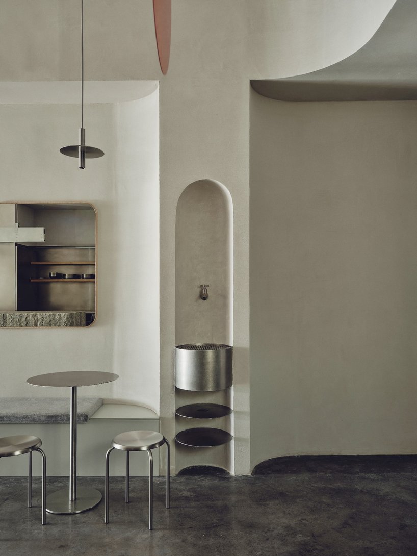 café's curved interiors by zooco estudio reflect art deco siboney building in spain