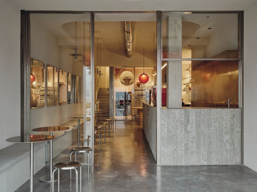 café's curved interiors by zooco estudio reflect art deco siboney building in spain