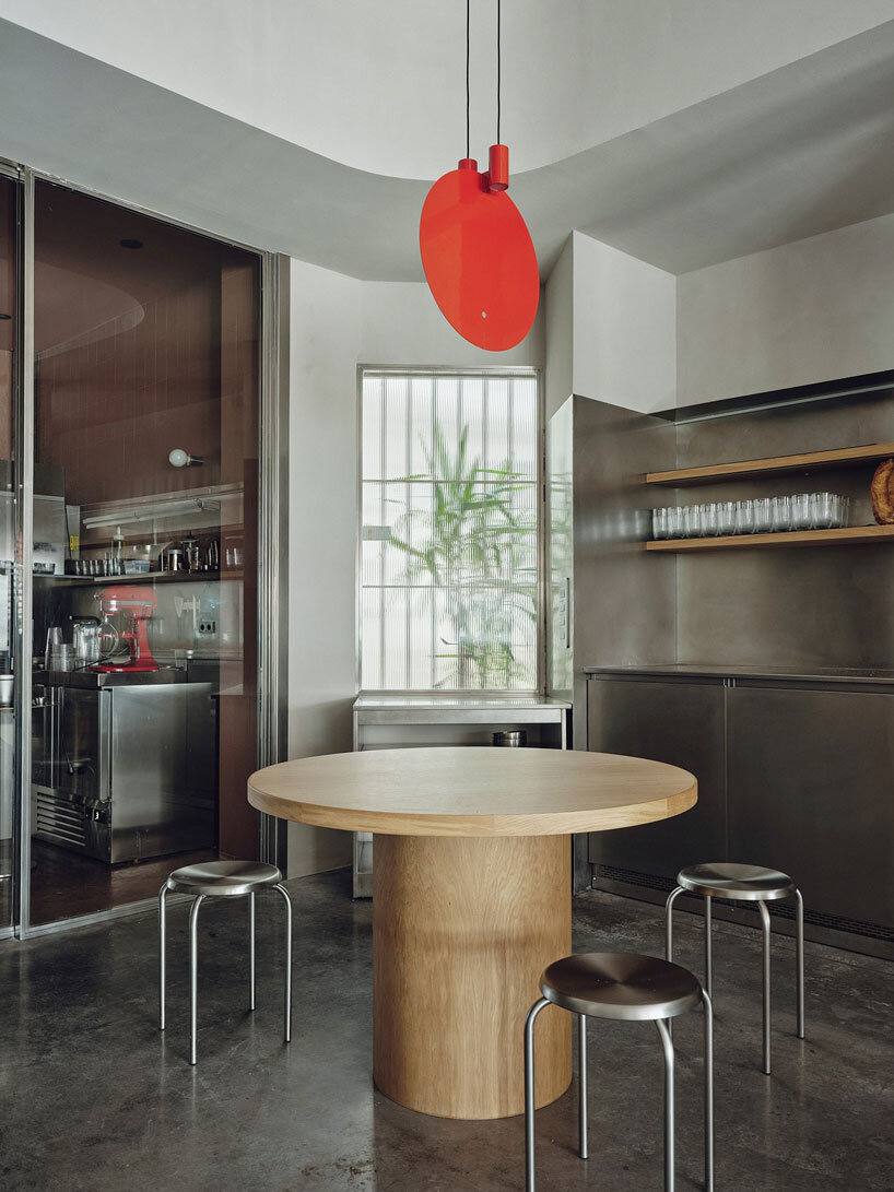 café's curved interiors by zooco estudio reflect art deco siboney building in spain