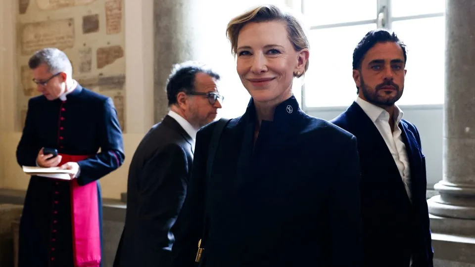 Cate Blanchett reacts in the Galleria Lapidaria of the Apostolic Palace after meeting Pope Leo. - Matteo Minnella/Reuters