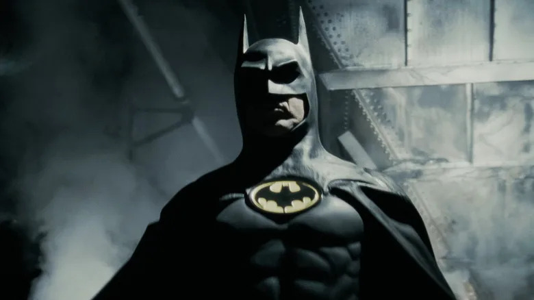 Batman emerges from a cloud of smoke in Batman