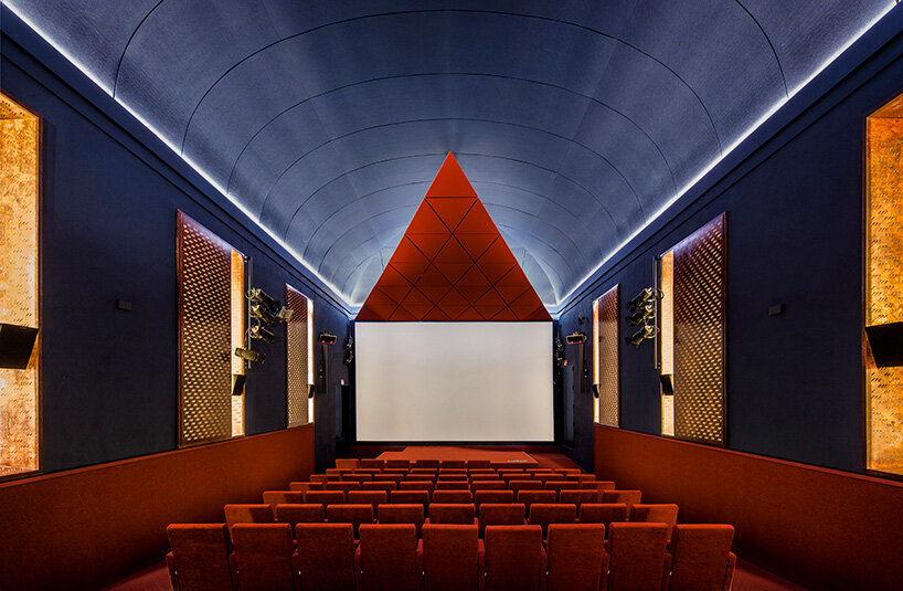 BACH converts reina sofía's auditorium into red-velvet cinema beneath blue vault in madrid