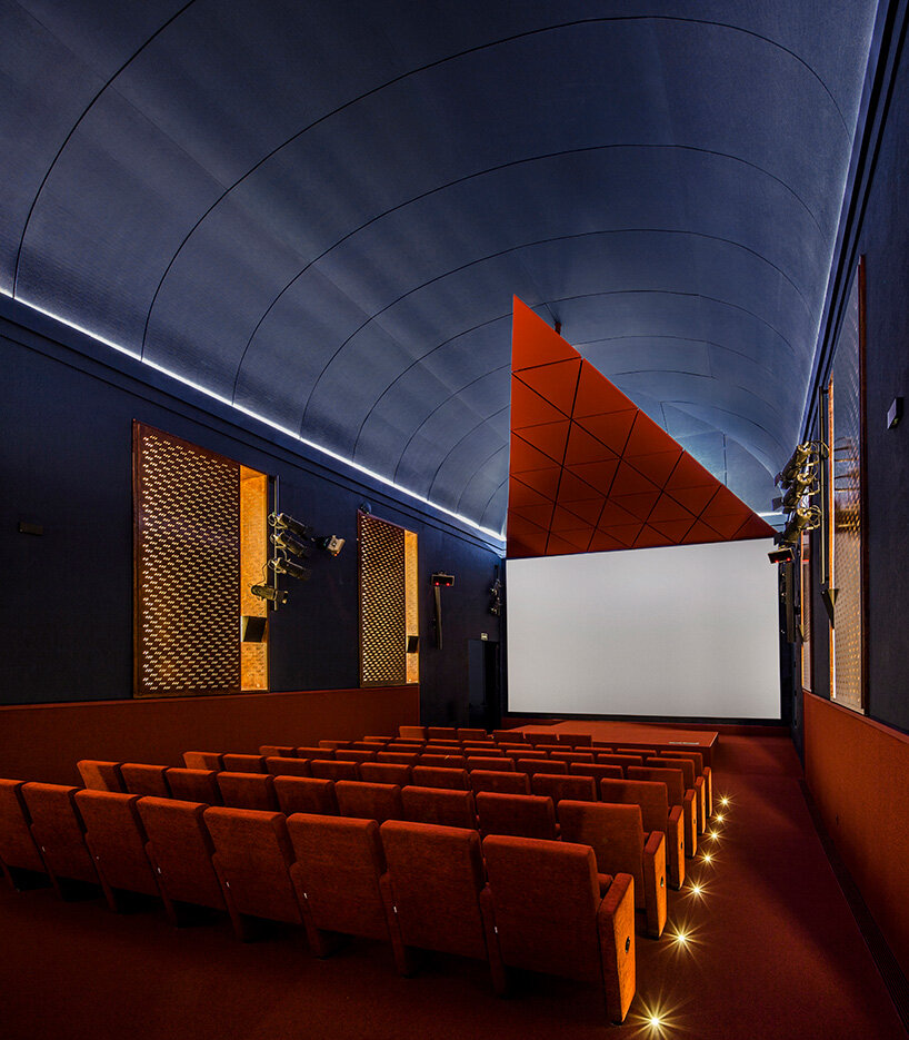 BACH converts reina sofía's auditorium into red-velvet cinema beneath blue vault in madrid