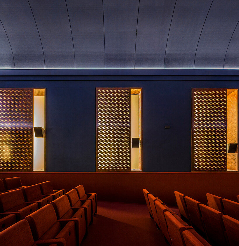 BACH converts reina sofía's auditorium into red-velvet cinema beneath blue vault in madrid