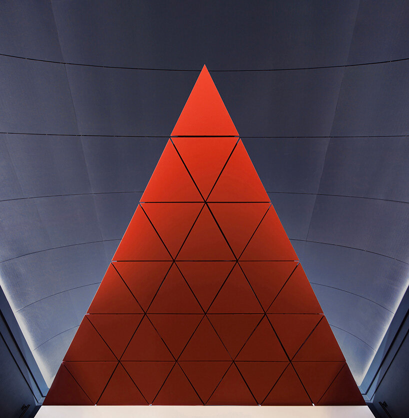 BACH converts reina sofía's auditorium into red-velvet cinema beneath blue vault in madrid