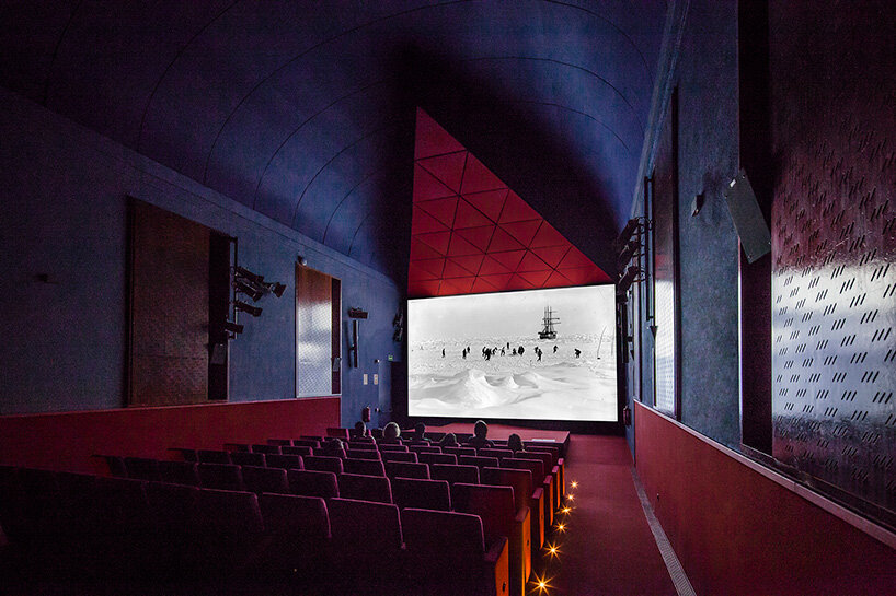 BACH converts reina sofía's auditorium into red-velvet cinema beneath blue vault in madrid