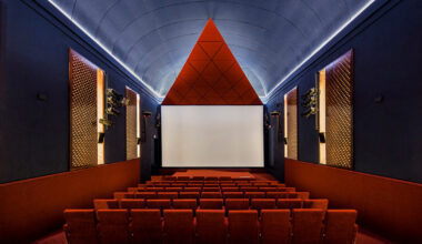 BACH converts historic auditorium into red-velvet cinema in madrid