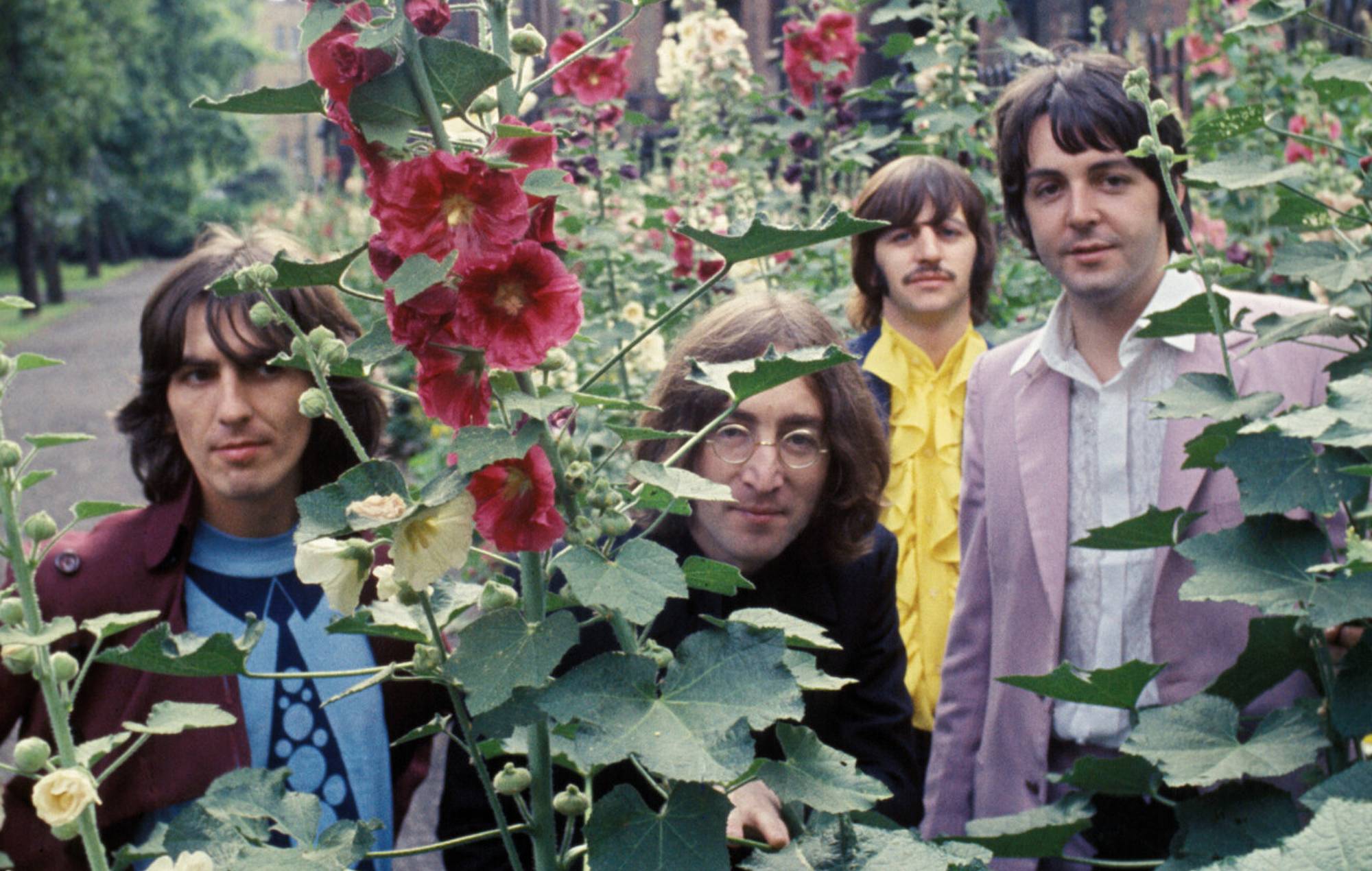 The Beatles during a photo session, St Pancras Old Church gardens, London, 28 July 1968. Jeremy Neech for Apple Corps
