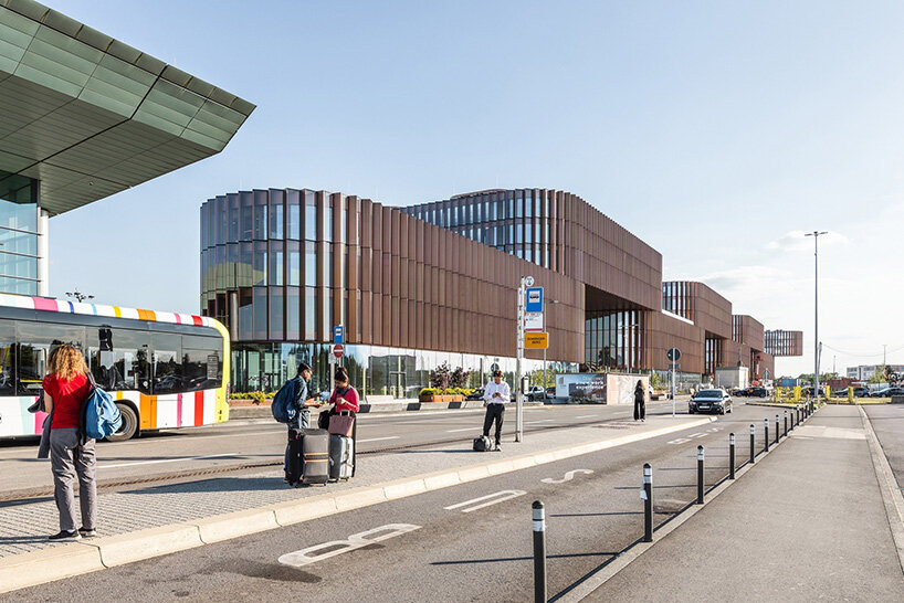 BIG's timber 'snakes' rise as skypark business center nears completion in luxembourg