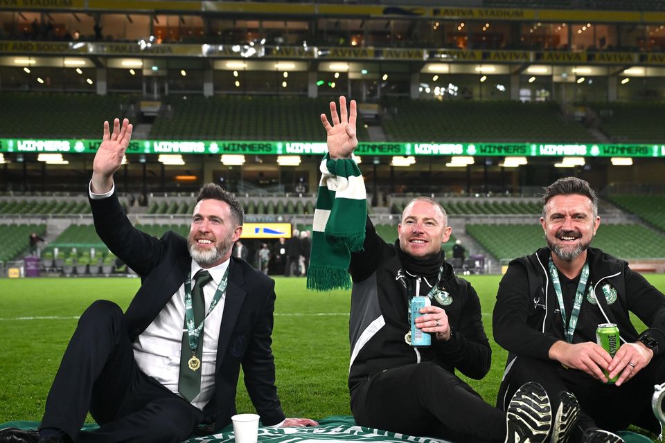 Shamrock Rovers manager Stephen Bradley, assistant coach Glenn Cronin and sporting director Stephen McPhail on the Aviva Stadium pitch with the FAI Cup trophy. Photo: Stephen McCarthy/Sportsfile
