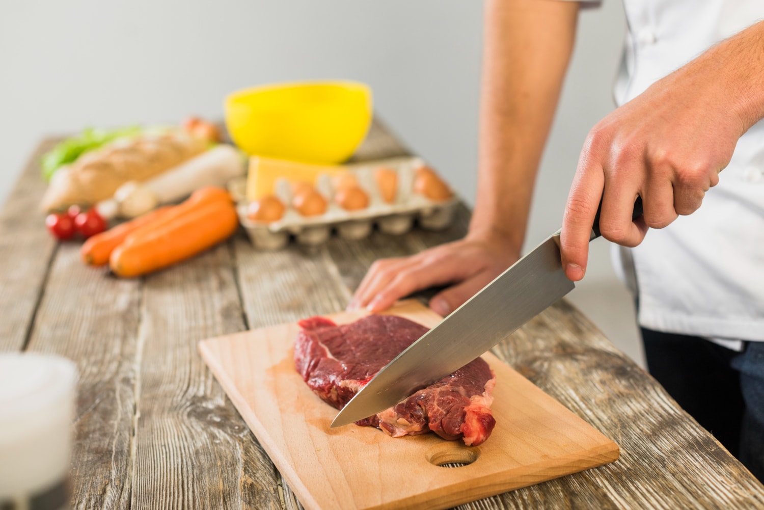 If you are using a common chopping board to cut raw meat, make sure you wash it well before using it again. (Picture credit: Freepik)