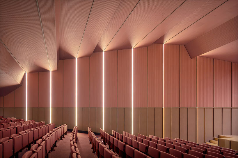 bright pink interior revitalizes adaptive acoustic music hall for sax’s cultural complex in spain