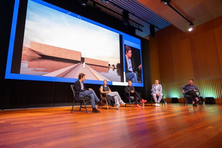 Dezeen's Max Fraser moderating a talk on luxury residential design