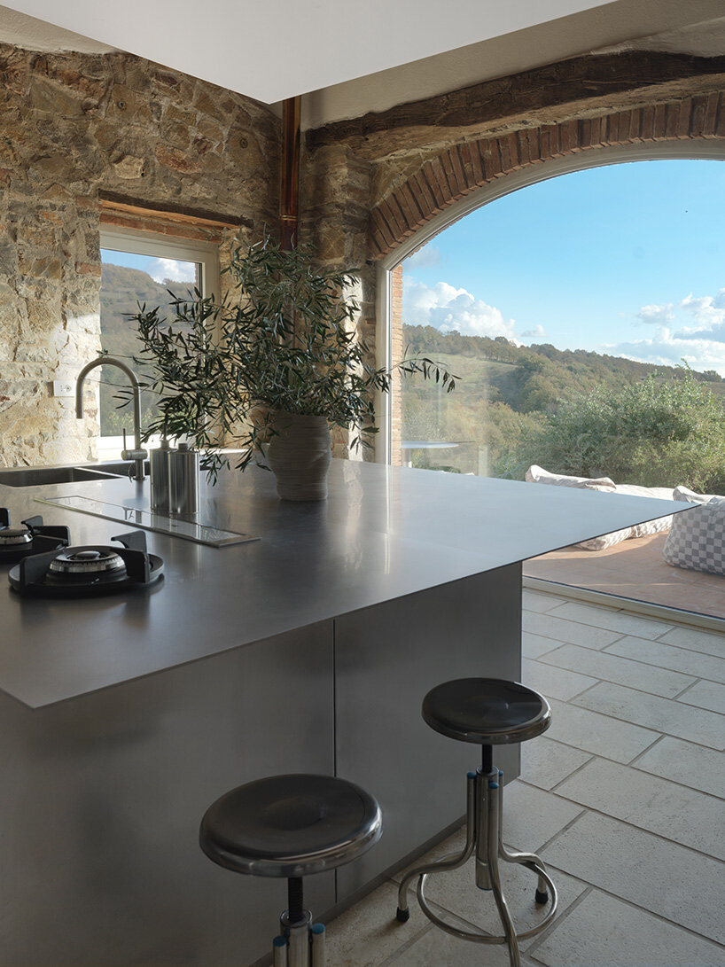 crosby studios restores 17th-century tuscan farmhouse with metallic and sculptural details