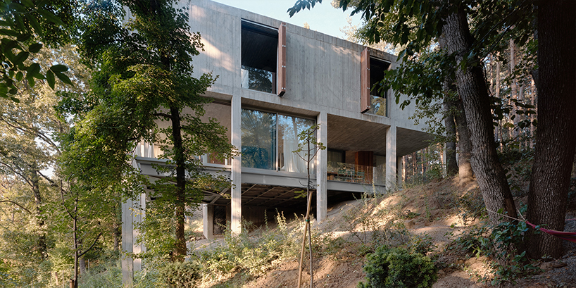 concrete columns lift residence above forested terrain in georgia