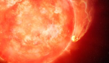 Stars destroy their planets: Large reddish star, with a planet almost touching it. The planet has a long tail of glowing material streaming behind it.