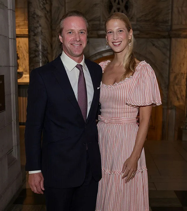 Thomas Kingston in a black suit poses next to wife Lady Gabriella in a pink dress