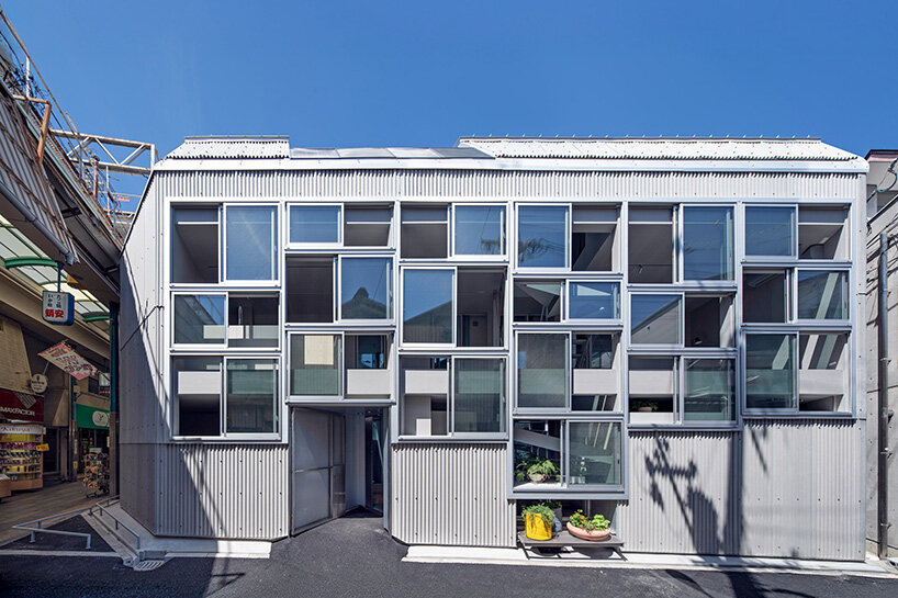 grid of operable windows fronts slender residence by okuwada architects in osaka