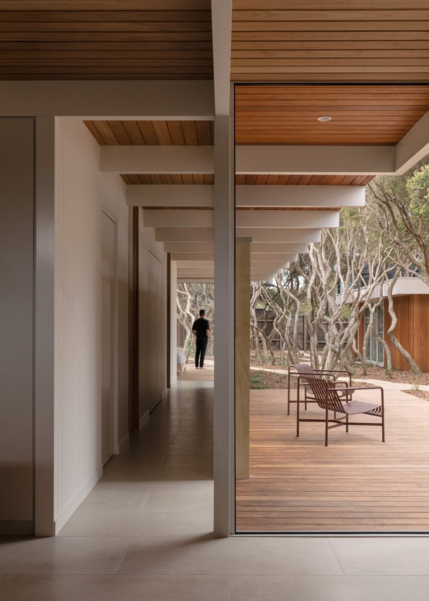 L-shaped house with large windows