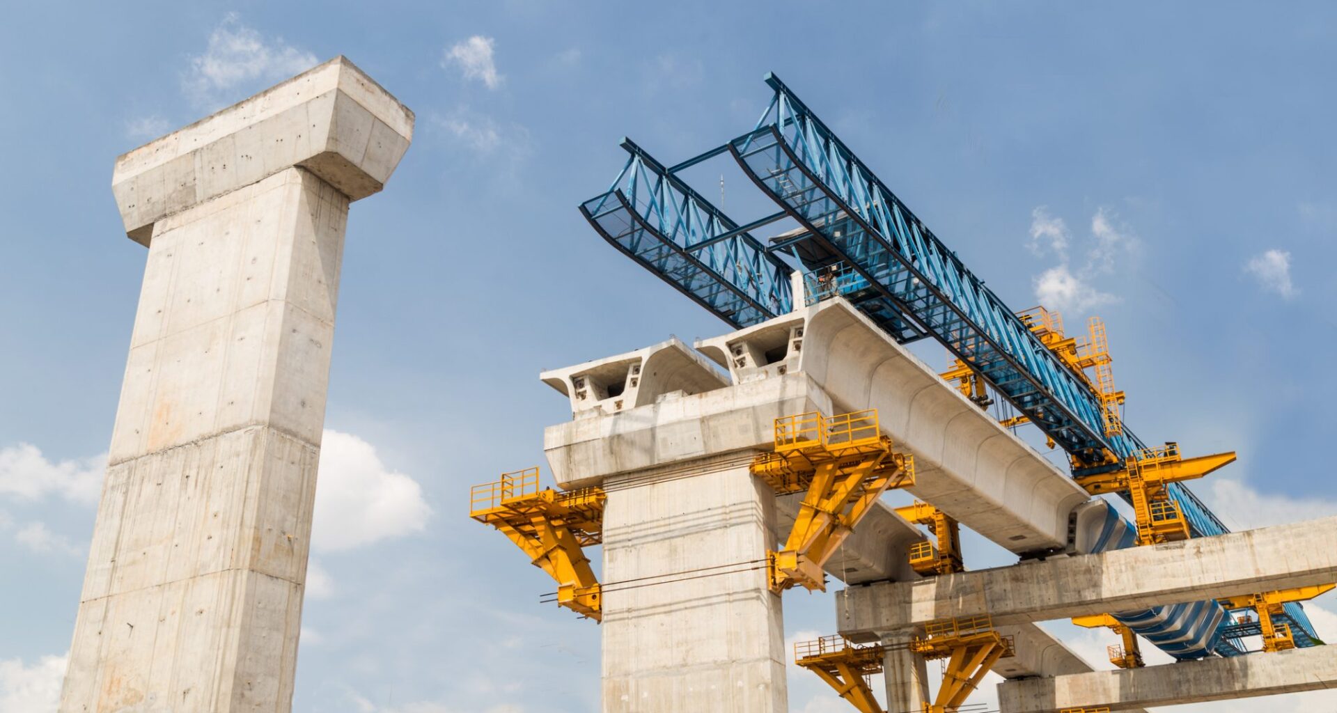 Construction of a mass transit train line in progress with heavy infrastructure. This photo shows the progress in joining the various blocks/modules of the line with heavy equipment.