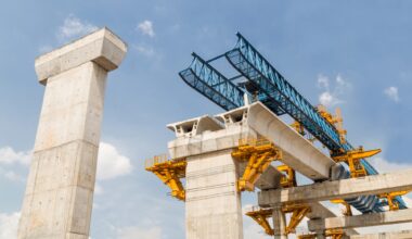 Construction of a mass transit train line in progress with heavy infrastructure. This photo shows the progress in joining the various blocks/modules of the line with heavy equipment.