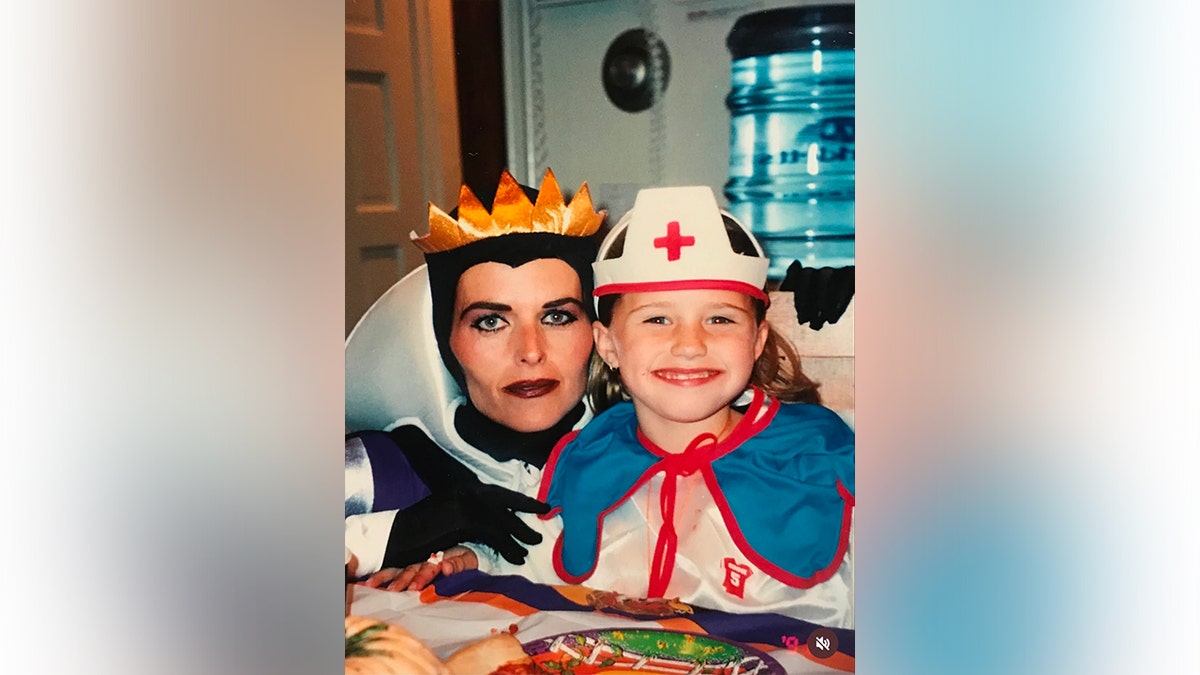 Katherine Schwarzenegger with mom Maria Shriver, both wearing Halloween costumes