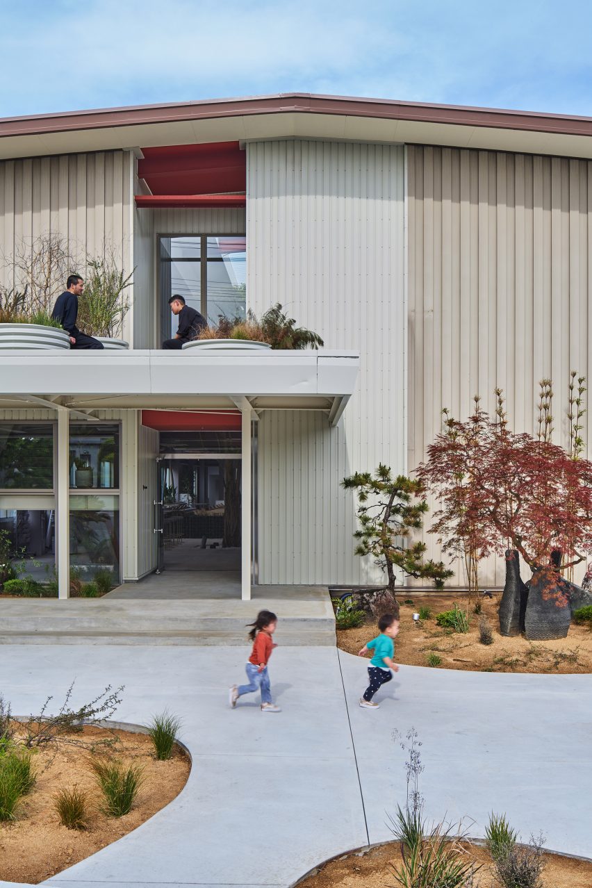 Steel office building with people outside