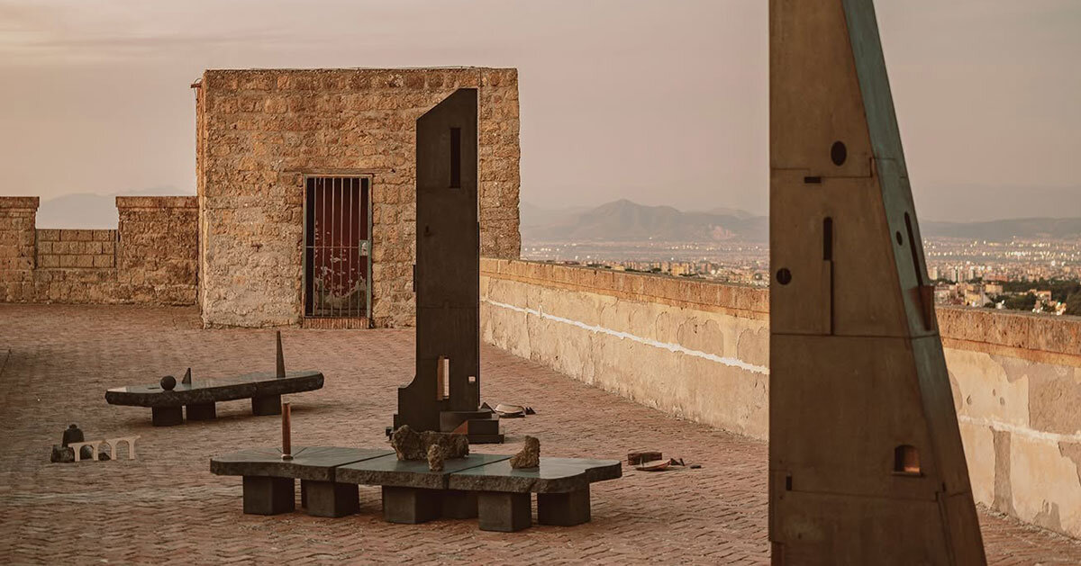 totemic sculptures compose volcanic stone installation in naples