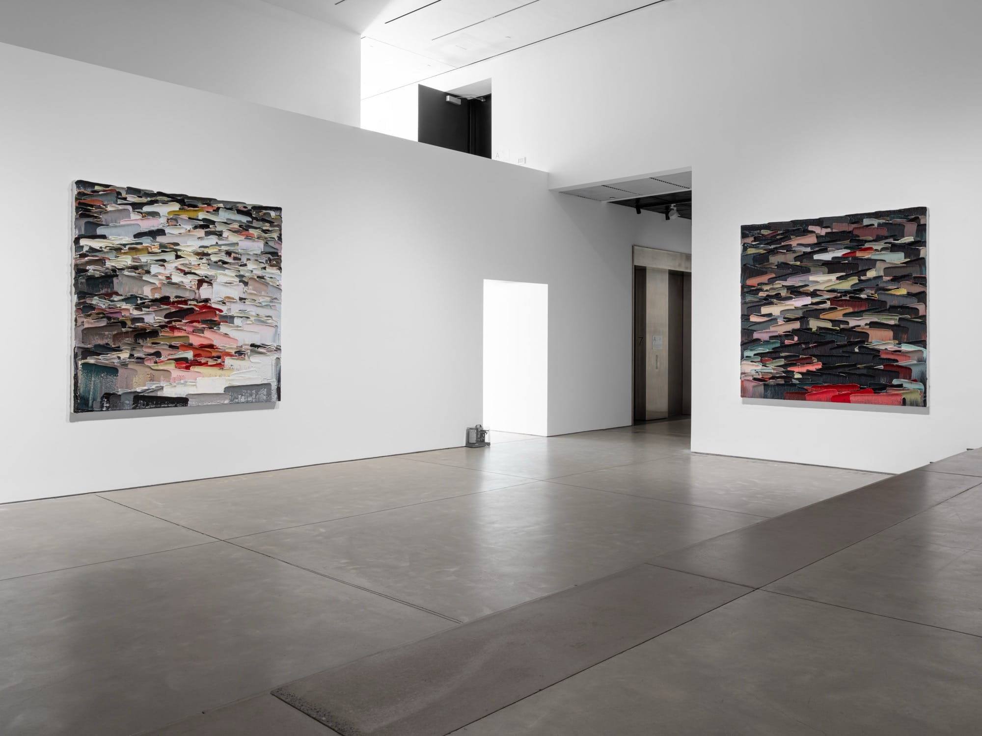 an installation view of paintings by Li Songsong