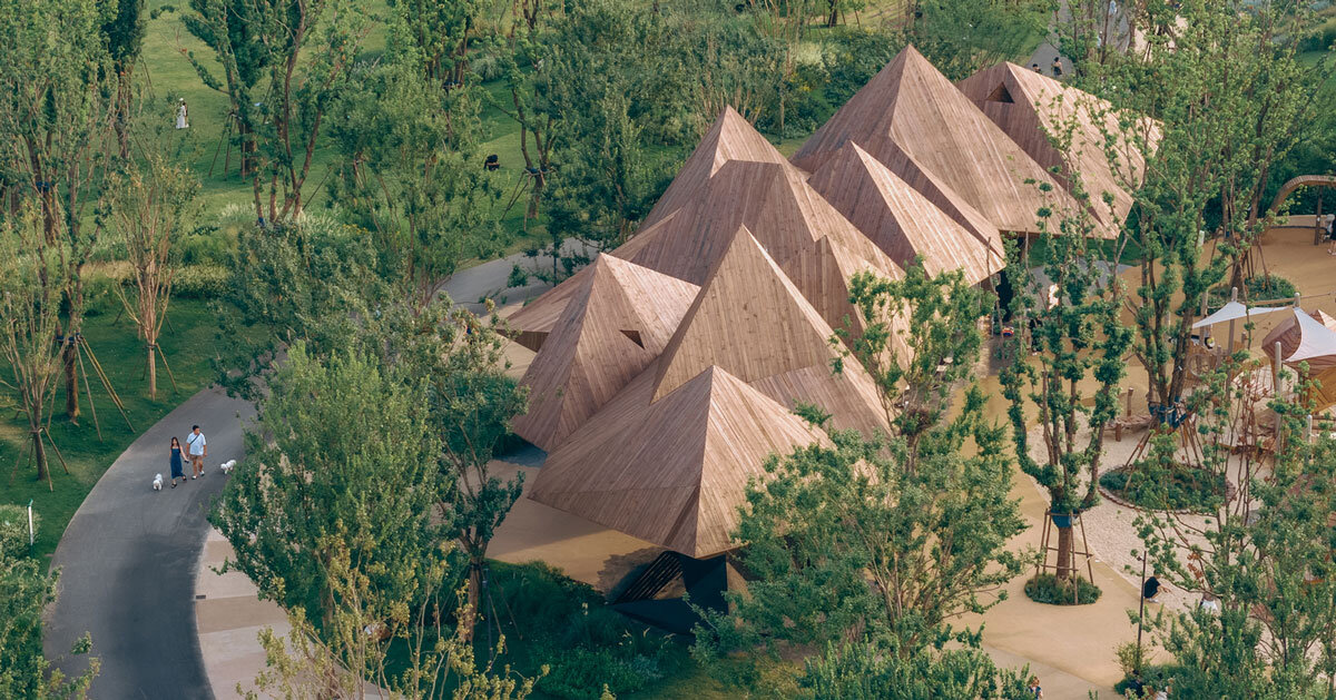 pyramidal wooden volumes frame luxeisland restaurant by DL atelier