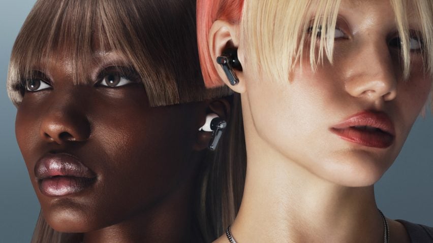 Two people wearing wireless earphones