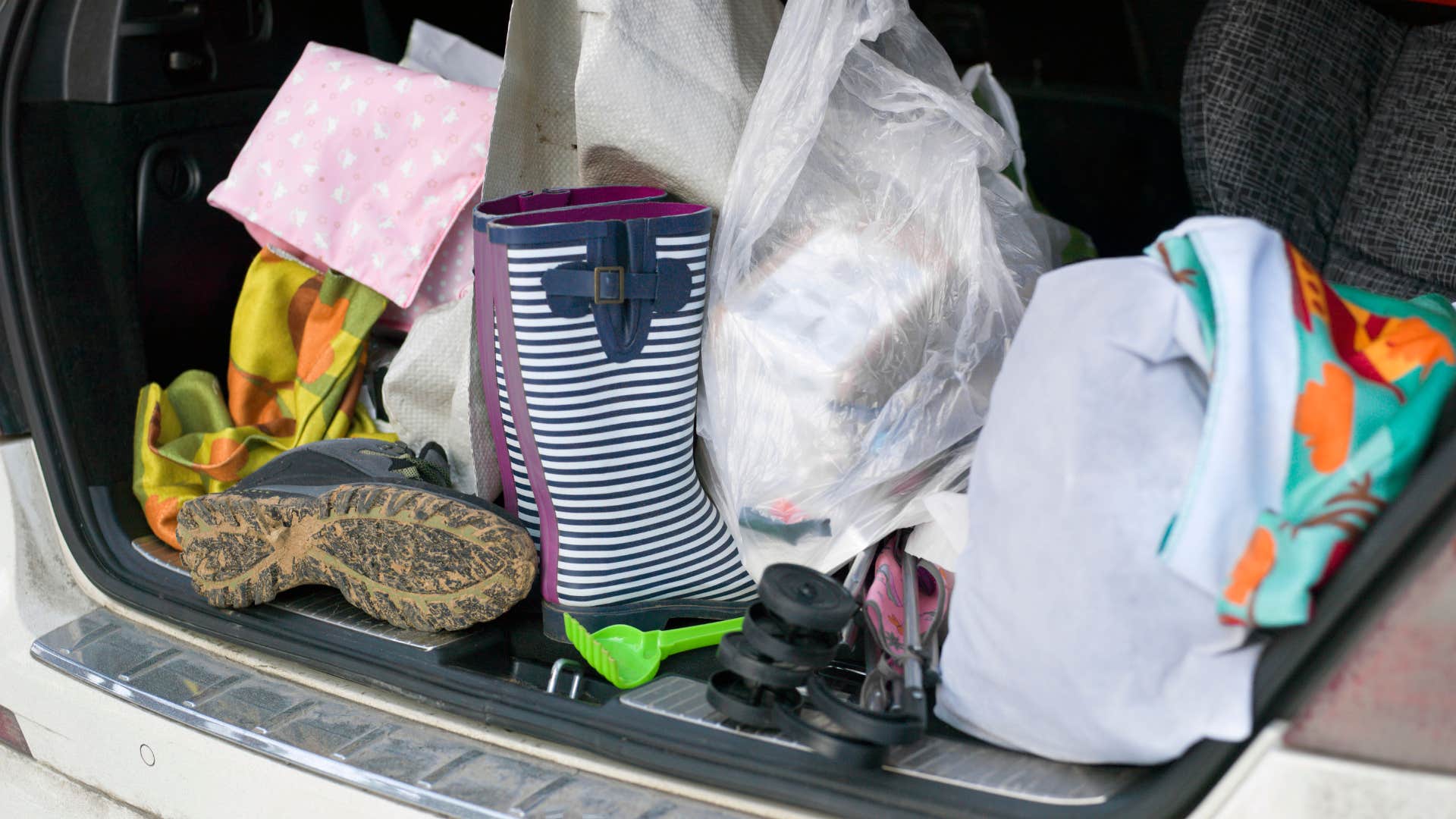 very messy trunk full of random things