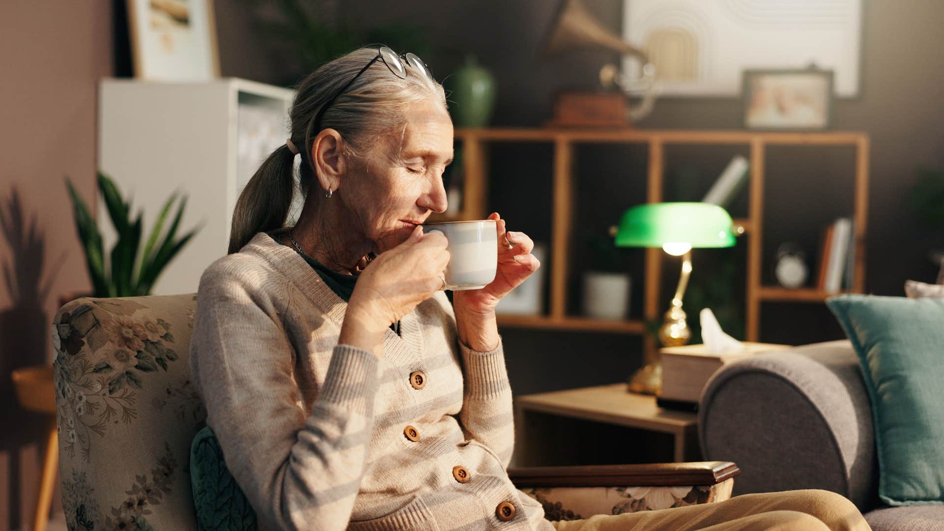 woman sitting on secondhand furniture couch