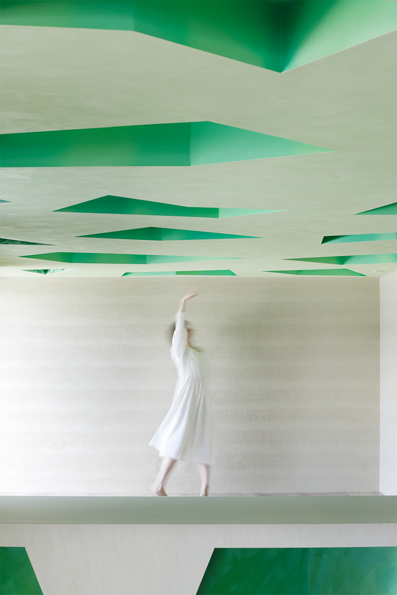 polygonal green cutouts animate kakushin tokyo office's interiors by moriyuki ochiai