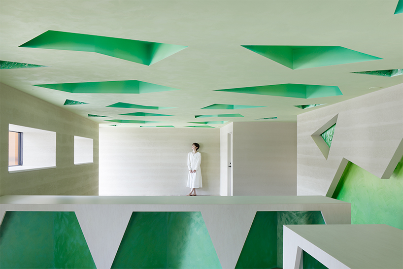 polygonal green cutouts animate kakushin tokyo office's interiors by moriyuki ochiai