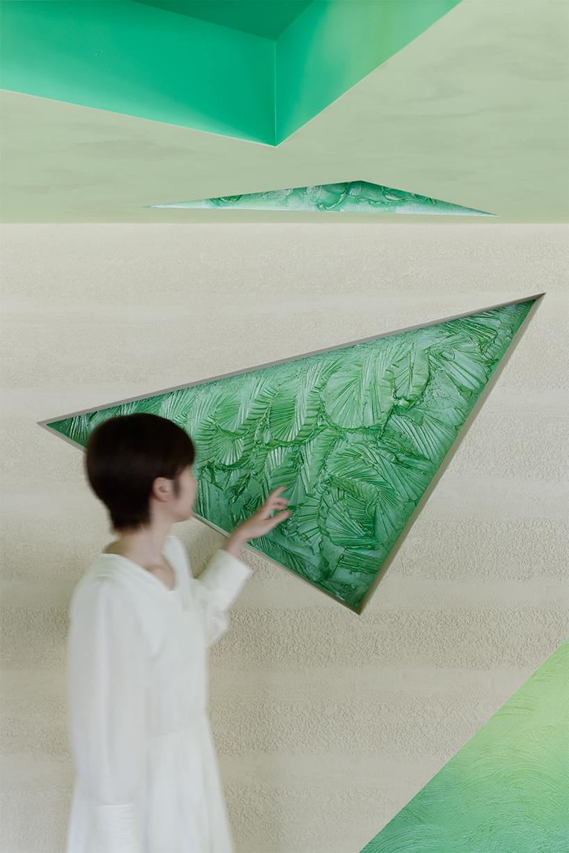 polygonal green cutouts animate kakushin tokyo office's interiors by moriyuki ochiai