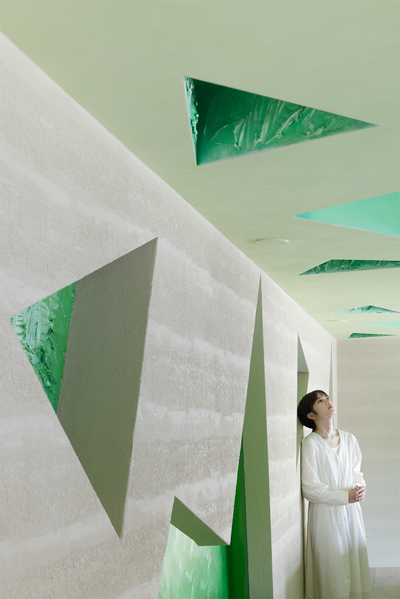polygonal green cutouts animate kakushin tokyo office's interiors by moriyuki ochiai