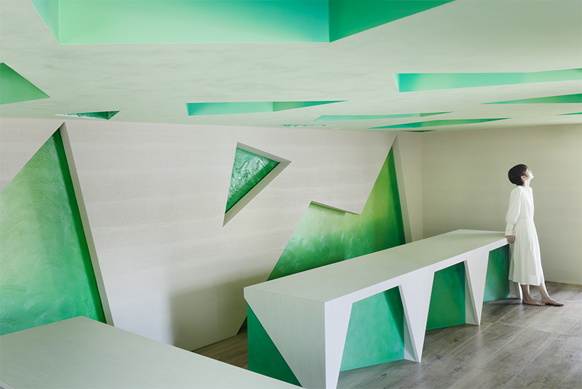 polygonal green cutouts animate kakushin tokyo office's interiors by moriyuki ochiai