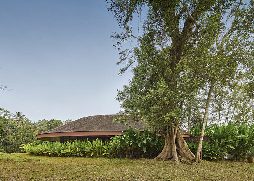 ring-shaped residence by alexis dornier wraps around verdant inner courtyard in bali