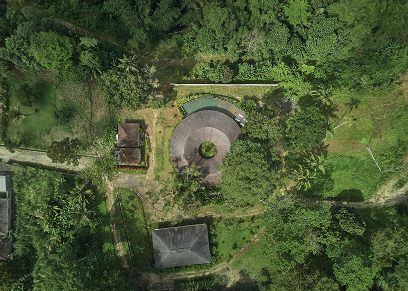 ring-shaped residence by alexis dornier wraps around verdant inner courtyard in bali