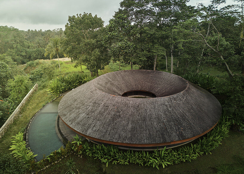ring-shaped residence by alexis dornier wraps around verdant inner courtyard in bali