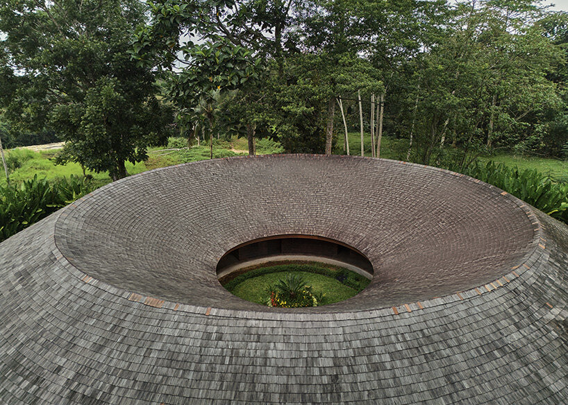 ring-shaped residence by alexis dornier wraps around verdant inner courtyard in bali