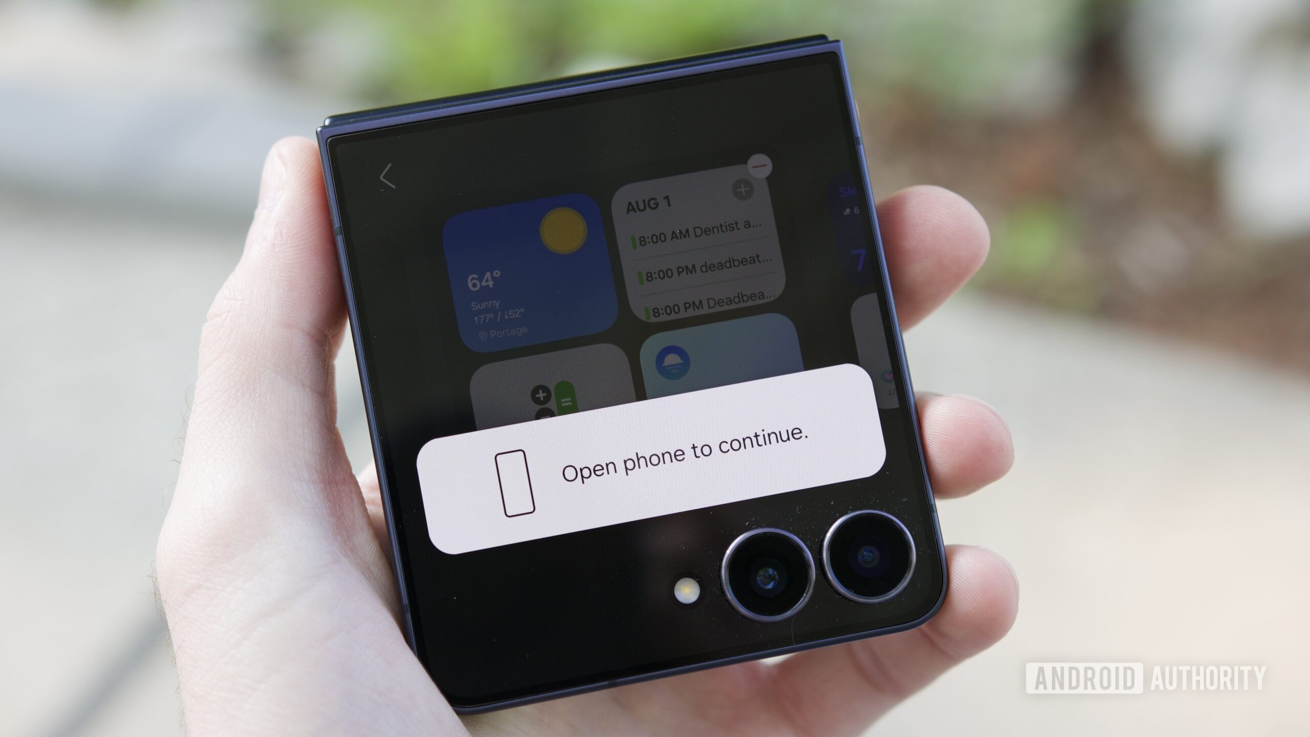 samsung galaxy z flip 7 review 4 "Open phone to continue" pop up on the Galaxy Z Flip 7 cover screen.
