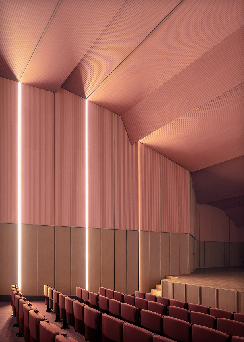 bright pink interior revitalizes adaptive acoustic music hall for sax’s cultural complex in spain
