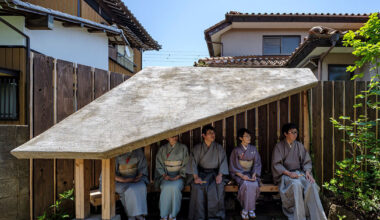moss-covered earthen roof shields teahouse’s waiting area in japan