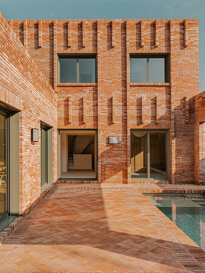 SIGLA studio organizes brick residence around two 'lungs' of light in spain