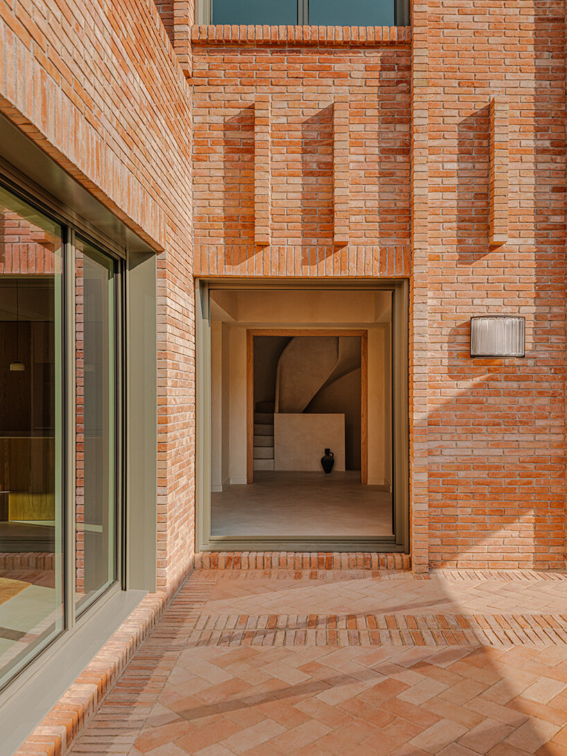 SIGLA studio organizes brick residence around two 'lungs' of light in spain
