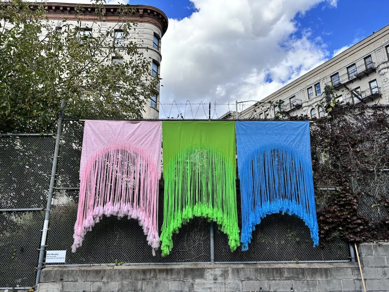 Installation by Ellie Murphy, hanging on the fence surrounding the Harlem parking lot.