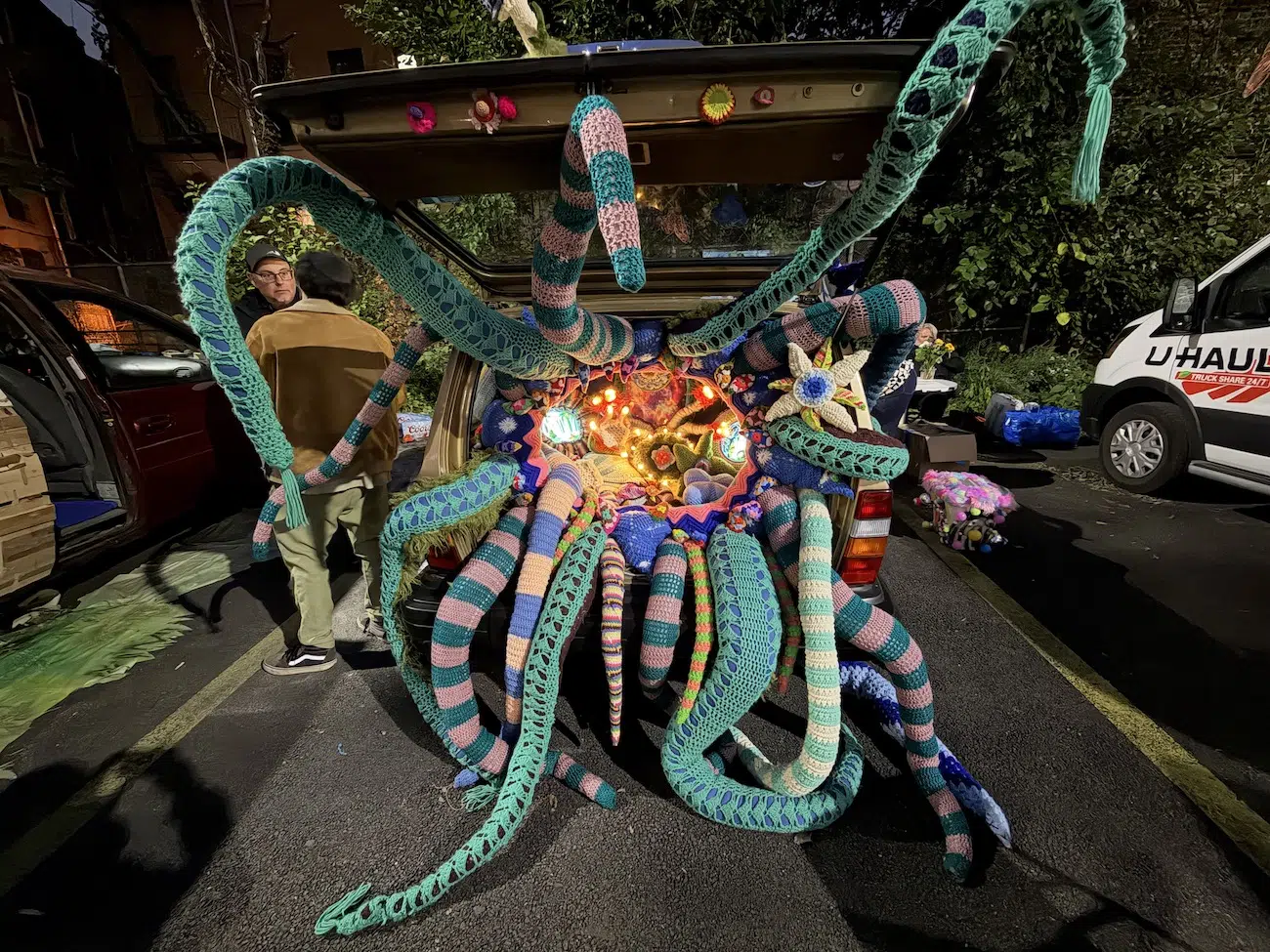 Jelia Gueramian’s installation inside a trunk, photographed at night.