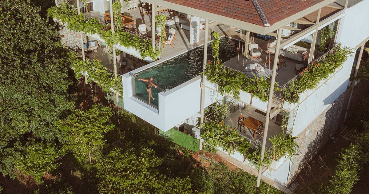cantilevered swimming pool extends out from studio saxe's 'villa nuri' in costa rica